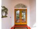 Double wood doors with arched window and sidelights at 1035 Beckley Cir, Venice, FL 34292