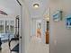 Clean hallway with views into the dining area and bathroom at 1035 Beckley Cir, Venice, FL 34292