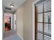 Hallway with view into an office and exterior at 1035 Beckley Cir, Venice, FL 34292