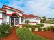 Landscaped front yard and two-car garage at 1035 Beckley Cir, Venice, FL 34292