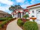 Front walkway to house entrance and two-car garage at 1035 Beckley Cir, Venice, FL 34292