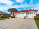 Two-car garage and nicely landscaped front yard at 1035 Beckley Cir, Venice, FL 34292