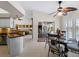 Casual kitchen nook with glass table and pool view at 1035 Beckley Cir, Venice, FL 34292