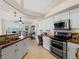 Well-equipped kitchen with stainless steel appliances and wood countertops at 1035 Beckley Cir, Venice, FL 34292