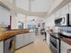 Well-equipped kitchen with stainless steel appliances and wood countertops at 1035 Beckley Cir, Venice, FL 34292