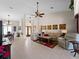 Open concept living room with high ceilings, and adjacent dining area at 1035 Beckley Cir, Venice, FL 34292