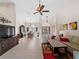 Spacious living area with high ceilings, tile floors, and a seating area at 1035 Beckley Cir, Venice, FL 34292