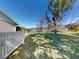 Backyard with lake view and white picket fence at 104 Woodingham Dr, Venice, FL 34292