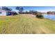 Expansive backyard with lake view and lush grass at 104 Woodingham Dr, Venice, FL 34292