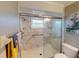 Clean bathroom, featuring a walk-in shower and marble accents at 104 Woodingham Dr, Venice, FL 34292