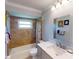 Updated bathroom with shower/tub, vanity, and marble countertop at 104 Woodingham Dr, Venice, FL 34292
