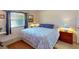 Bright bedroom with a king-size bed and window at 104 Woodingham Dr, Venice, FL 34292