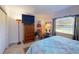 Comfortable bedroom with king-size bed and a view at 104 Woodingham Dr, Venice, FL 34292