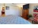 King bedroom with TV, dresser, and sliding closet doors at 104 Woodingham Dr, Venice, FL 34292