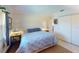 Bright bedroom with king-size bed and large windows at 104 Woodingham Dr, Venice, FL 34292