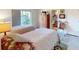 Guest bedroom with two twin beds and ensuite bath at 104 Woodingham Dr, Venice, FL 34292