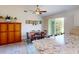 Bright dining area with table and chairs, near kitchen and slider to patio at 104 Woodingham Dr, Venice, FL 34292