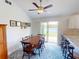 Bright dining area with sliding doors leading to a patio at 104 Woodingham Dr, Venice, FL 34292
