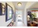 Bright and airy entryway with tile floor and bench at 104 Woodingham Dr, Venice, FL 34292