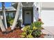 Front entrance with white door and stone accents at 104 Woodingham Dr, Venice, FL 34292