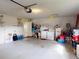 Garage with washer, dryer, and ample storage at 104 Woodingham Dr, Venice, FL 34292