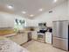 Modern kitchen with granite countertops and stainless steel appliances at 104 Woodingham Dr, Venice, FL 34292
