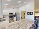 Modern kitchen with granite countertops and stainless steel appliances at 104 Woodingham Dr, Venice, FL 34292