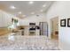 Modern kitchen with granite countertops and stainless steel appliances at 104 Woodingham Dr, Venice, FL 34292