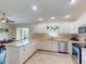 Spacious kitchen, granite counters, and stainless steel appliances at 104 Woodingham Dr, Venice, FL 34292