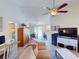 Living room with view into kitchen and dining area, and access to backyard at 104 Woodingham Dr, Venice, FL 34292