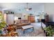 Open living room with seating area and view into dining area at 104 Woodingham Dr, Venice, FL 34292