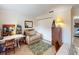 Home office with ample workspace, sitting area, and closet at 104 Woodingham Dr, Venice, FL 34292