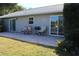 Brick paved patio with seating area and access to backyard at 104 Woodingham Dr, Venice, FL 34292