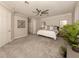 Spacious bedroom with carpet and ceiling fan at 10792 Tarflower Dr # 202, Venice, FL 34293