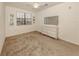 Bright bedroom featuring a dresser and large window at 10792 Tarflower Dr # 202, Venice, FL 34293