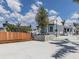 White community center with wood bench and landscaping at 10792 Tarflower Dr # 202, Venice, FL 34293