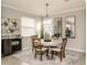 Charming dining room with wooden table and chairs at 10792 Tarflower Dr # 202, Venice, FL 34293