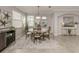 Elegant dining room with round table and neutral color scheme at 10792 Tarflower Dr # 202, Venice, FL 34293