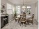Elegant dining room with round table and neutral color scheme at 10792 Tarflower Dr # 202, Venice, FL 34293