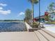 Wooden dock with steps leading to lake and walkway at 10792 Tarflower Dr # 202, Venice, FL 34293