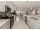 Modern kitchen with white cabinets and a large island at 10792 Tarflower Dr # 202, Venice, FL 34293