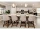 Modern kitchen with white cabinets, quartz countertops, and stainless steel appliances at 10792 Tarflower Dr # 202, Venice, FL 34293