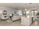 Modern kitchen with white cabinets and island at 10792 Tarflower Dr # 202, Venice, FL 34293
