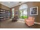 Community library with comfortable seating and large windows at 10792 Tarflower Dr # 202, Venice, FL 34293