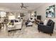 Spacious living room with comfortable seating and large TV at 10792 Tarflower Dr # 202, Venice, FL 34293