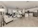 Open living room and kitchen with tile flooring at 10792 Tarflower Dr # 202, Venice, FL 34293