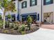 Outdoor patio with tables, chairs, and umbrellas at 10792 Tarflower Dr # 202, Venice, FL 34293
