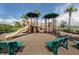 playground with slides, climbing structures, and benches at 10792 Tarflower Dr # 202, Venice, FL 34293