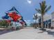 Outdoor plaza with shade structure and palm trees at 10792 Tarflower Dr # 202, Venice, FL 34293