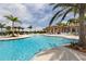 Stunning pool area with plenty of lounge chairs at 10792 Tarflower Dr # 202, Venice, FL 34293